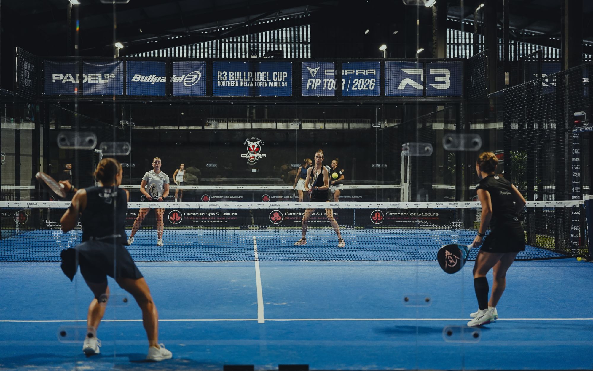 Doubles action under the lights on Padel54's tournament courts