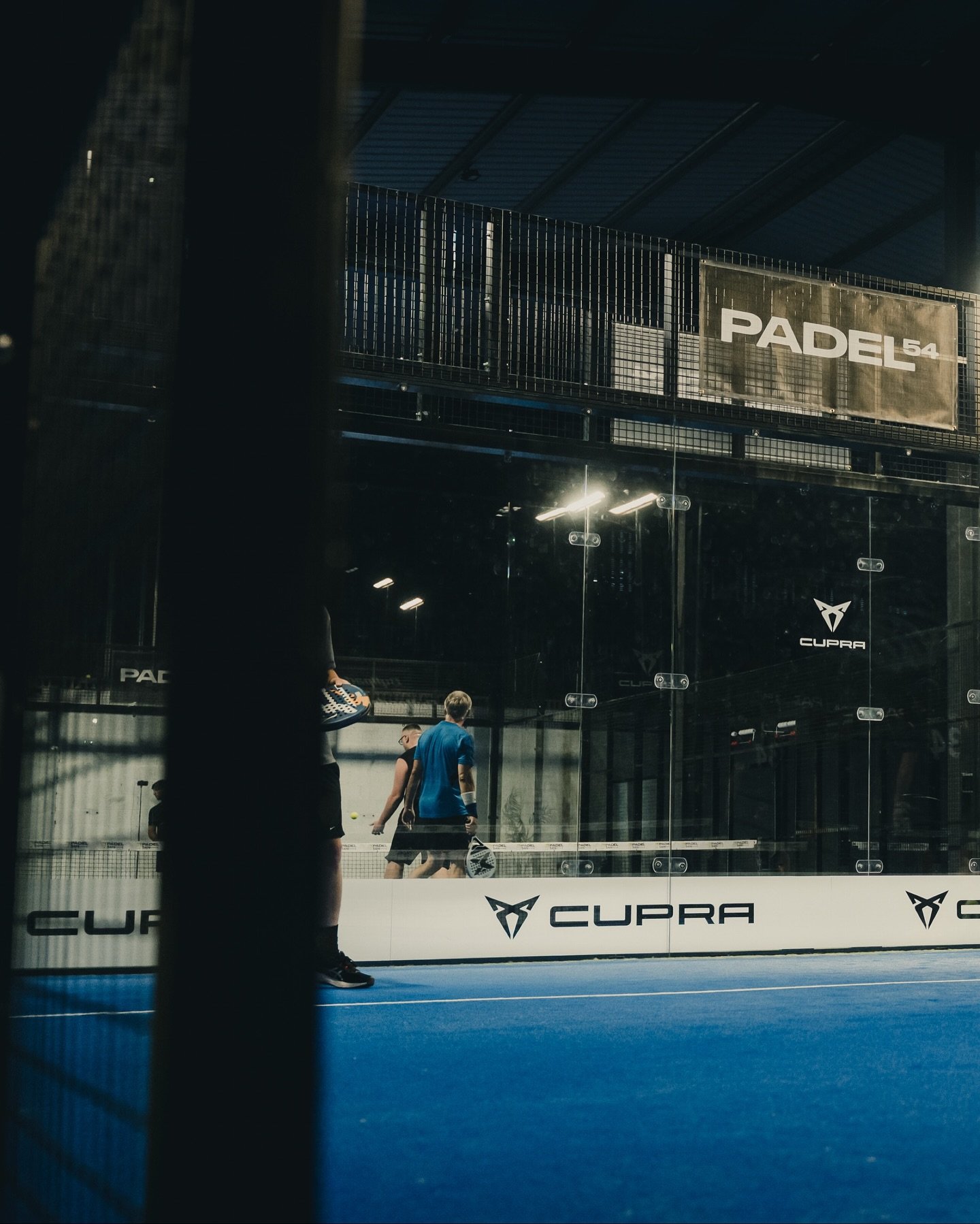 Players warming up on the newly Cupra-branded Court 2 at Padel54
