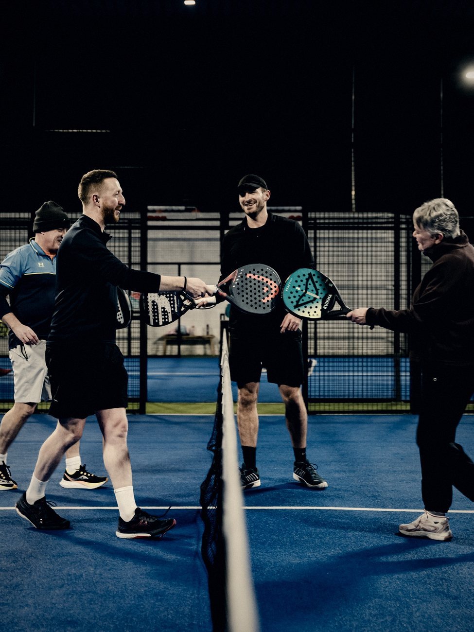Players enjoying a social at Padel54